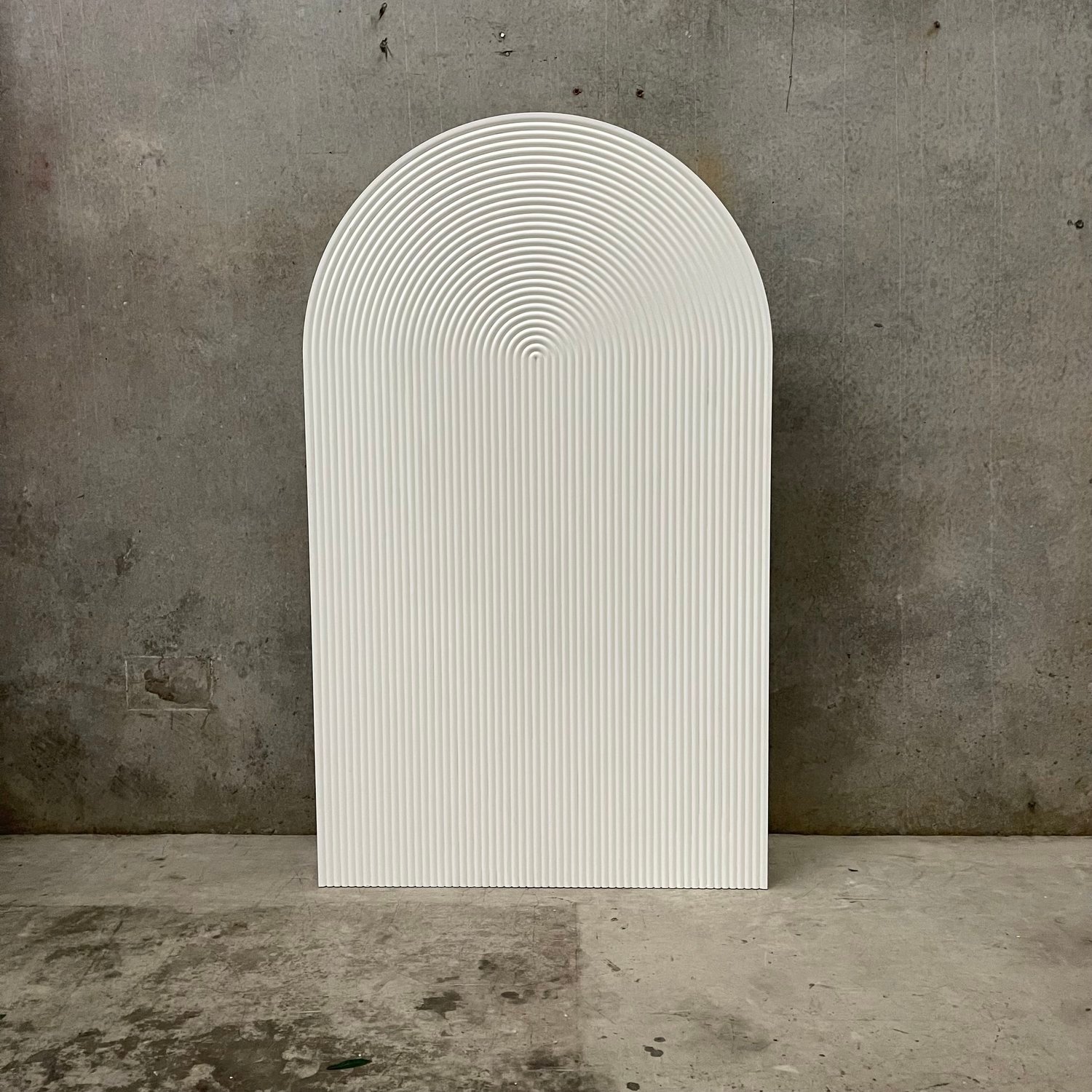 Fluted arch backdrop with vertical texture styled for a Melbourne wedding